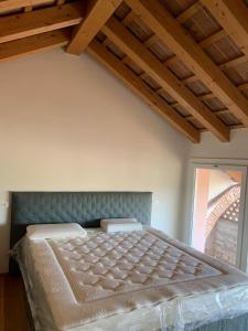 En eller flere senger på et rom på b&b Agriturismo San Matteo