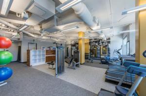 a gym with treadmills and exercise equipment and balloons at Fantastic Condo 1BR at Crystal Flats in Arlington