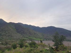 a view of a valley with mountains in the background at Cabañas Ocoa in Hijuelas +42 photos