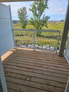 a balcony with a gate and a view of a field at Townhouse in Ottawa