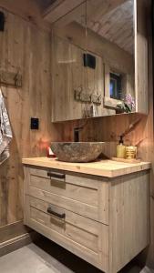 a bathroom with a counter with a sink in it at Liaplassen Mountain Chalet - Beitostølen in Beitostøl