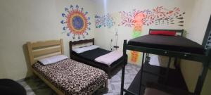 Ένα ή περισσότερα κρεβάτια σε δωμάτιο στο Casa da Luz stl Hostel