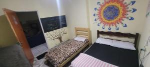 Ένα ή περισσότερα κρεβάτια σε δωμάτιο στο Casa da Luz stl Hostel