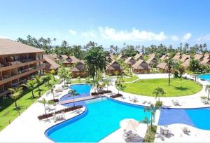 an aerial view of a resort with a pool at Flat praia dos carneiros eco resort 26 in Tamandaré