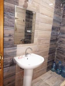 a bathroom with a sink and a mirror at Al Makramia compound in Hurghada