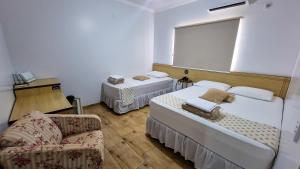 Postel nebo postele na pokoji v ubytování Golden View Hotel