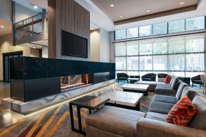 a living room with a couch and a fireplace at Residence Inn by Marriott Tempe Downtown/University in Tempe