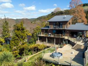 an aerial view of a house with a deck at The Terrace Lake Tarawera in Lake Tarawera