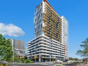 a rendering of a tall building on a street at Luxury 2Beds Apt with stunning View (Parking, Gym) in Sydney