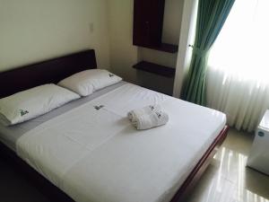 Postel nebo postele na pokoji v ubytování Hotel Preferencial Class
