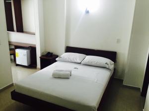 Postel nebo postele na pokoji v ubytování Hotel Preferencial Class