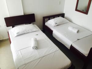 Postel nebo postele na pokoji v ubytování Hotel Preferencial Class