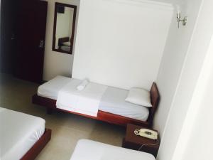 Postel nebo postele na pokoji v ubytování Hotel Preferencial Class