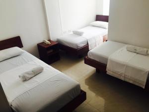 Postel nebo postele na pokoji v ubytování Hotel Preferencial Class