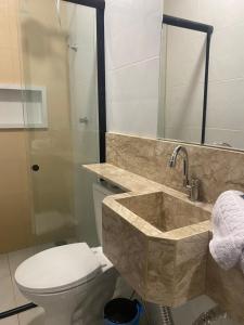 a bathroom with a sink and a toilet at Origem in Mamanguape