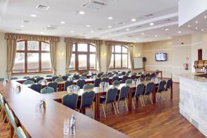 a conference room with a long table and chairs at Hotel Zieleniec in Zieleniec