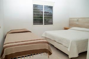 Katil atau katil-katil dalam bilik di Sierras Apartamentos +22 gambar
