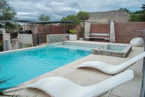 a swimming pool on top of a building at Sierras Apartamentos in Villa Santa Cruz del Lago