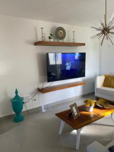 TV a/nebo společenská místnost v ubytování Apartment Serena Village Punta Cana