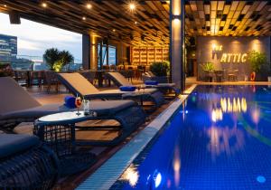 a swimming pool on the roof of a building at Northern Charm Hotel in Ho Chi Minh City