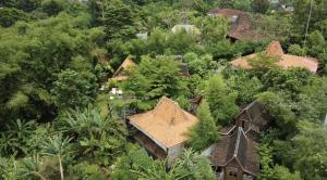 an overhead view of a house in the forest at Ubuntu Bali Eco Yoga Retreat - CANGGU in Canggu
