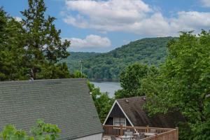 a view of a lake from a house at Charming 4 Bedroom 4 bathroom Lake view home in Lampe