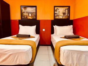 Letto o letti in una camera di Smart Budget Hotel - Klang