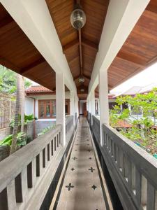 a hallway of a house with a wooden ceiling at Rumah di Patra Kuningan, Jaksel in Jakarta