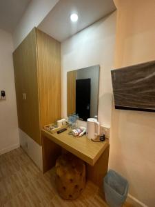 a bathroom with a vanity with a mirror at Midnight Blue Guesthouse in Luang Prabang +45 photos