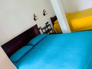 Llit o llits en una habitació de Bella Ella