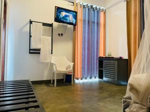 TV a/nebo společenská místnost v ubytování Kithal Ella Station Resort