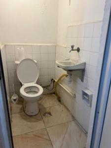 a bathroom with a toilet and a sink at Spacious House by the Sea in Gemlik