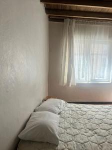 a bed in a bedroom with a window at Spacious House by the Sea in Gemlik