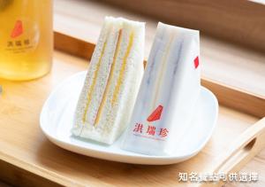 two sandwiches on a plate on a table at 美寓藝術文旅 Meistay Art Gallery Hotel in Taipei