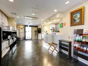 a room with a store with a counter and a table at Miyazaki Lions Hotel in Miyazaki