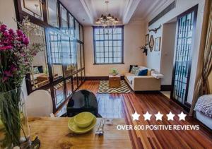 a large living room with a couch and a fireplace at Shanghai Art Decor Suite W Nanjing Rd FFC in Shanghai +20 photos
