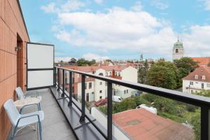 a balcony with a view of a city at Bright & Trendy Gdańsk Apartment with Balcony by Renters in Gdańsk
