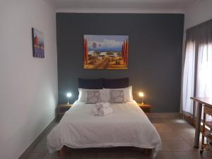 Postel nebo postele na pokoji v ubytování 7 On Grey Guesthouse