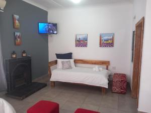 Postel nebo postele na pokoji v ubytování 7 On Grey Guesthouse