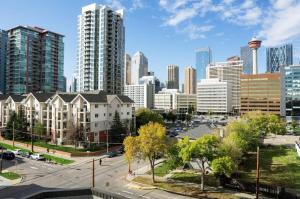 a view of a city with tall buildings at Cozy apartment with amazing view in Calgary