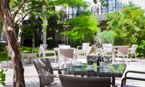 a table and chairs with drinks on top at Kyukaruizawa Kikyo, Curio Collection by Hilton in Karuizawa