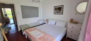 Posteľ alebo postele v izbe v ubytovaní Family House in Gerakini