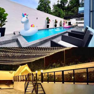 a view of a pool with a inflatable unicorn next to it at SKVilla private pool+ktv+bbq+starview up to 35pax in Ayer Keroh