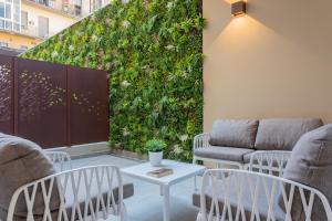 O zonă de relaxare la Green Luxury Apartment by Wonderful Italy