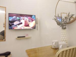 TV a/nebo společenská místnost v ubytování VG Pension and Residences