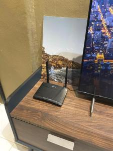 TV a/nebo společenská místnost v ubytování Dar Al Kahfi - Plaza Temerloh