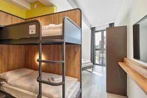 Postel nebo postele na pokoji v ubytování MEININGER Hotel Köln West