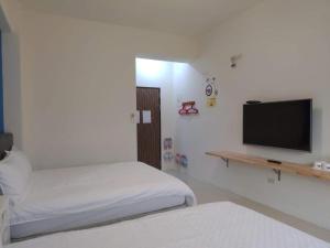 Postel nebo postele na pokoji v ubytování King X.S. B&B