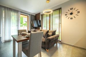 TV a/nebo společenská místnost v ubytování Tatra Square Apartments