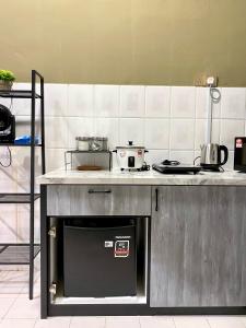 Kuchyň nebo kuchyňský kout v ubytování Dar Al Kahfi - Plaza Temerloh